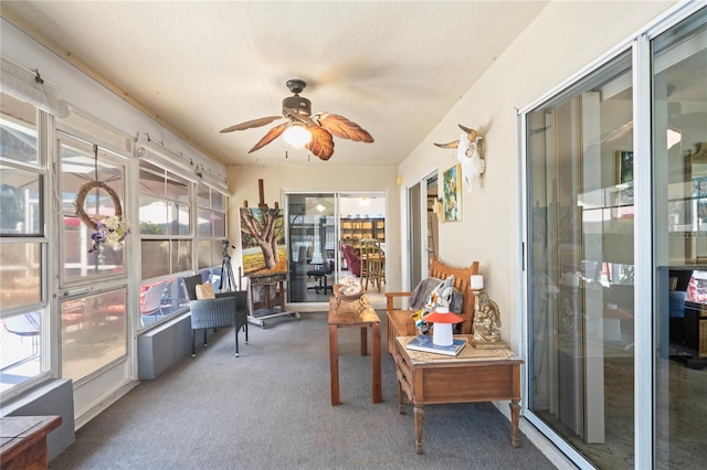 sunroom with a ceiling fan