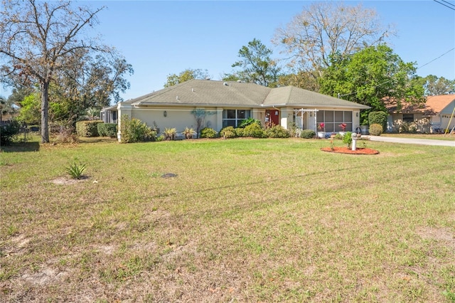 single story home with a front lawn