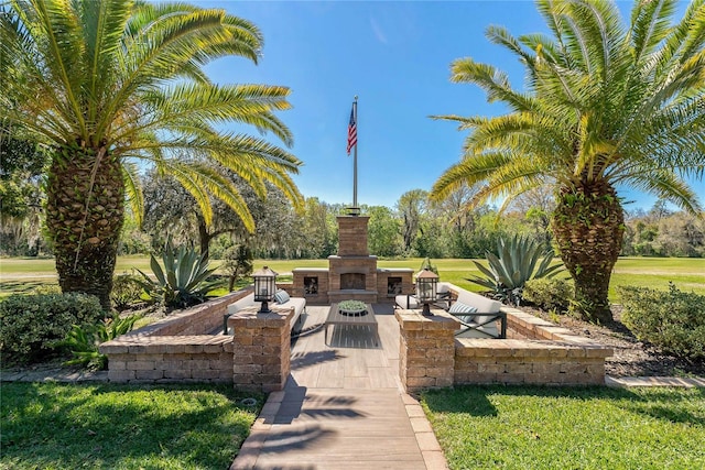 view of community with a yard and a patio