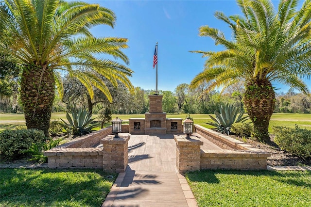 view of community with a patio area and a yard