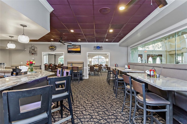 dining space featuring a drop ceiling, recessed lighting, visible vents, and carpet floors