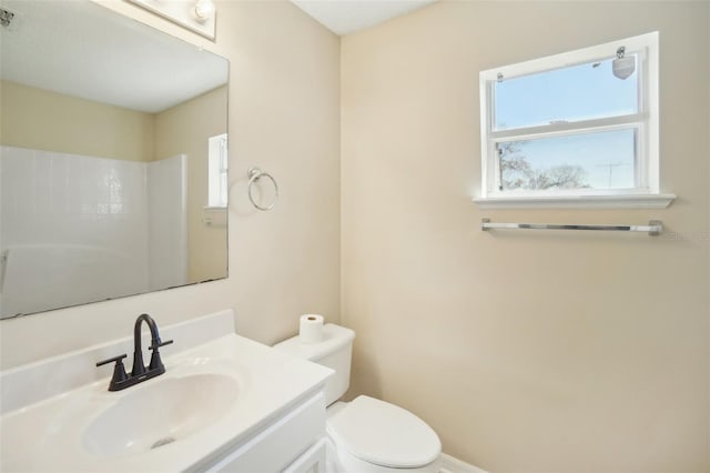 bathroom featuring toilet, visible vents, and vanity