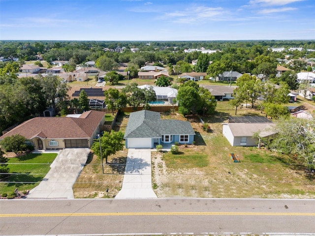 birds eye view of property with a residential view