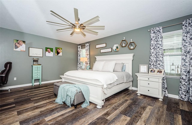 bedroom featuring ceiling fan, wood finished floors, and baseboards