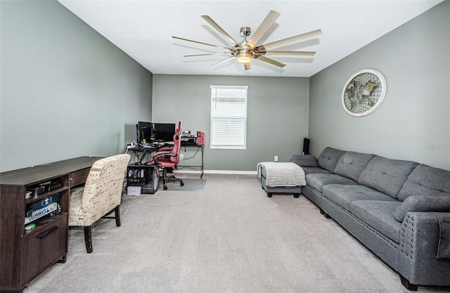 office area featuring ceiling fan, carpet flooring, and baseboards