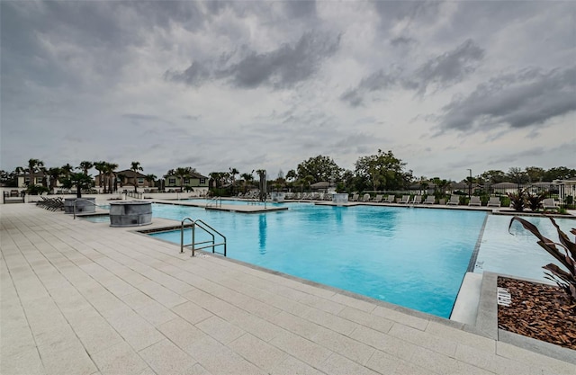 community pool featuring a patio area