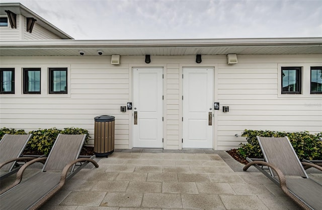 entrance to property featuring a patio area