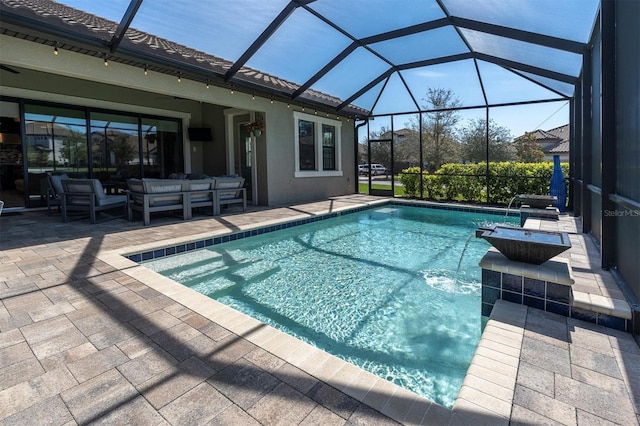 outdoor pool with a lanai, outdoor lounge area, and a patio