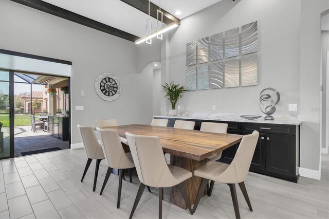 dining area featuring baseboards