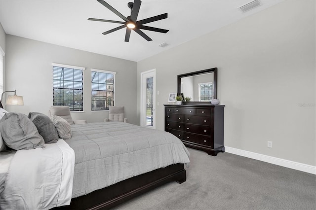 bedroom with carpet floors, baseboards, visible vents, and a ceiling fan