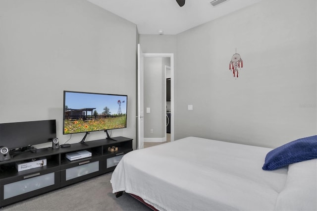 bedroom with visible vents, carpet flooring, and a ceiling fan