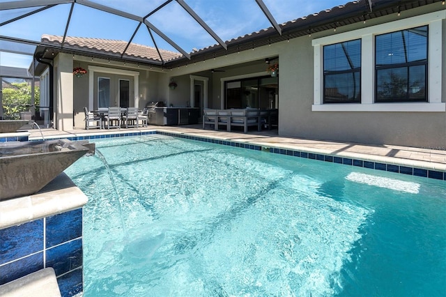 outdoor pool with a patio area, glass enclosure, french doors, and outdoor lounge area