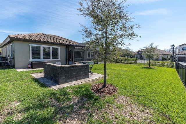 view of yard with a lanai, a fenced backyard, and a patio