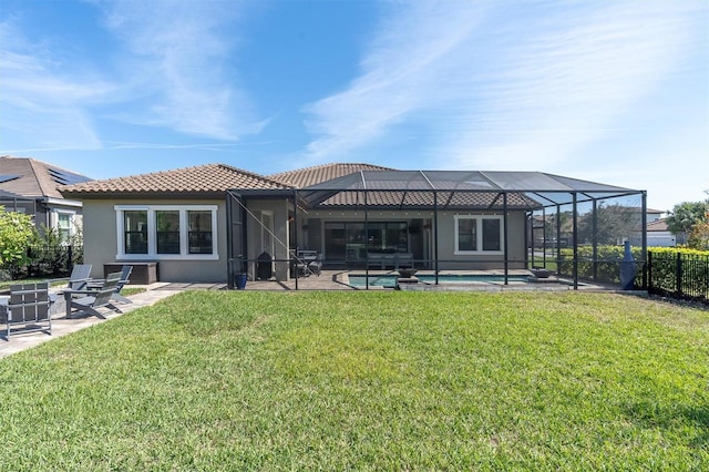 back of house featuring a tile roof, a patio, stucco siding, glass enclosure, and an outdoor pool