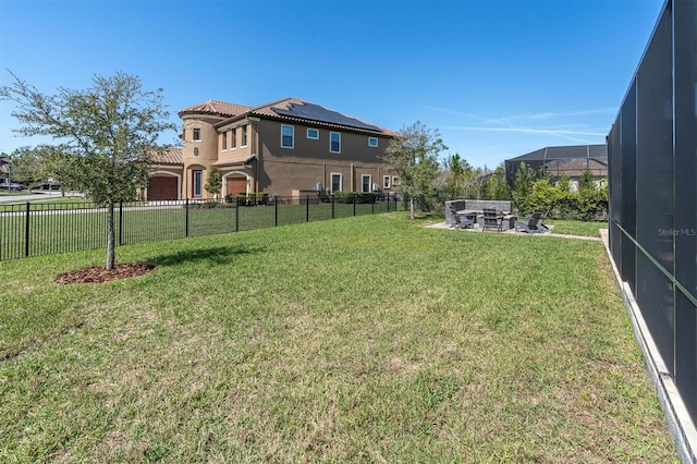 view of yard with fence and a lanai