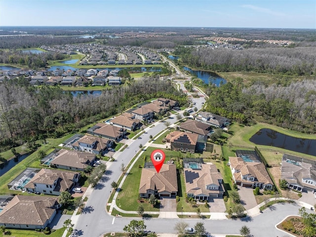 birds eye view of property featuring a residential view and a water view