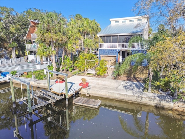 dock area featuring a water view and boat lift