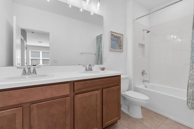 bathroom featuring toilet, shower / tub combo, a sink, and tile patterned floors