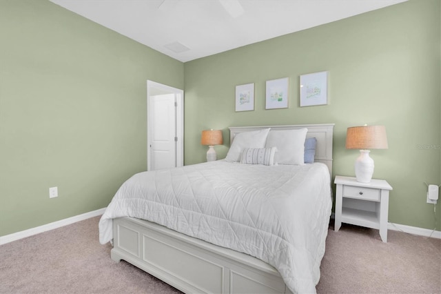 carpeted bedroom with a ceiling fan and baseboards