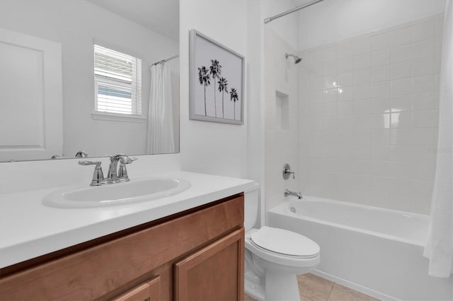 bathroom featuring tile patterned flooring, shower / tub combo with curtain, vanity, and toilet