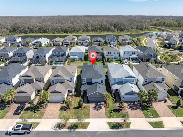 aerial view with a residential view and a water view