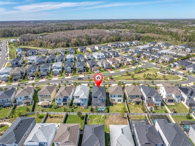 birds eye view of property with a residential view