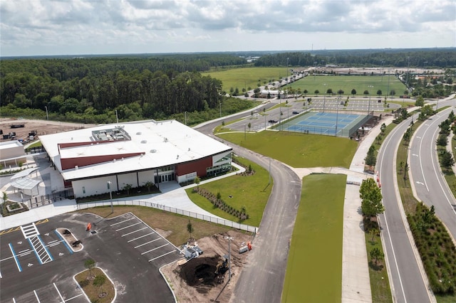 drone / aerial view featuring a forest view