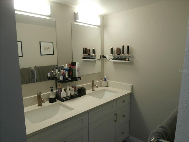 bathroom featuring double vanity and a sink