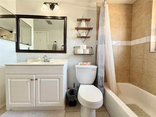 bathroom featuring shower / tub combo, toilet, vanity, and tile patterned flooring