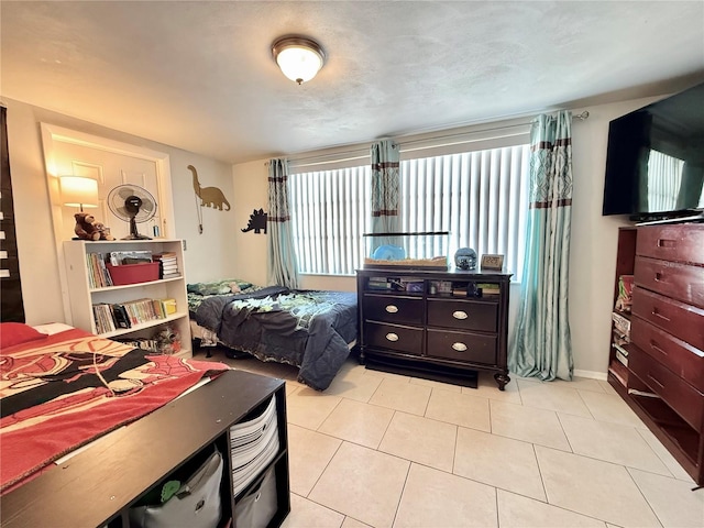 bedroom with light tile patterned flooring