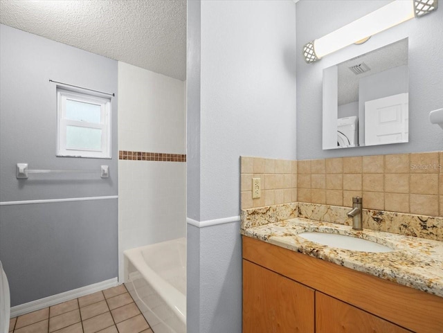 bathroom featuring visible vents, decorative backsplash, tile patterned floors, a textured ceiling, and vanity