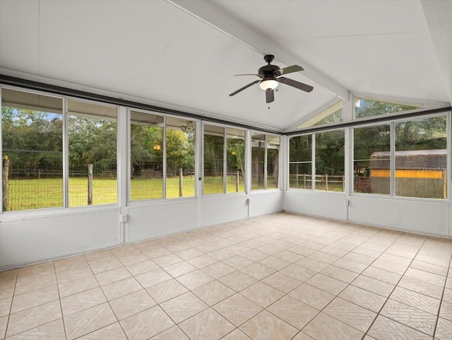 unfurnished sunroom featuring lofted ceiling with beams and a ceiling fan