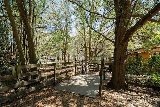 view of home's community with fence