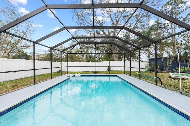 view of swimming pool featuring a fenced in pool, a lanai, and a fenced backyard