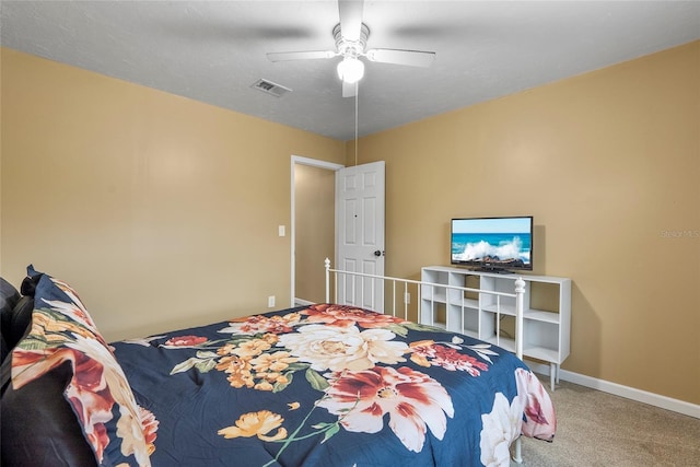 bedroom featuring a ceiling fan, carpet flooring, visible vents, and baseboards