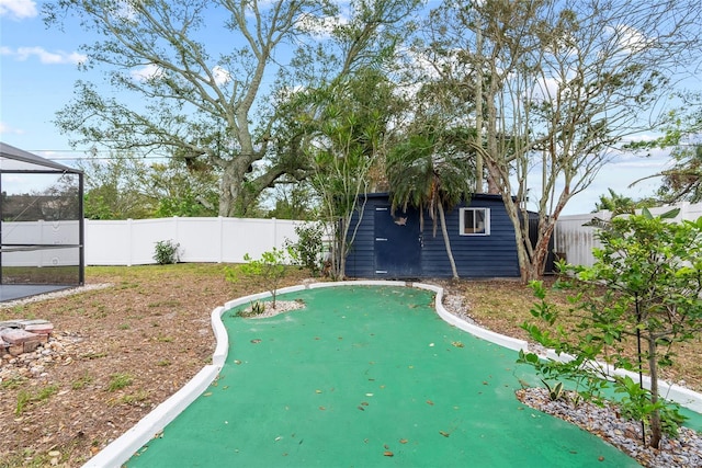 exterior space with an outbuilding and a fenced backyard