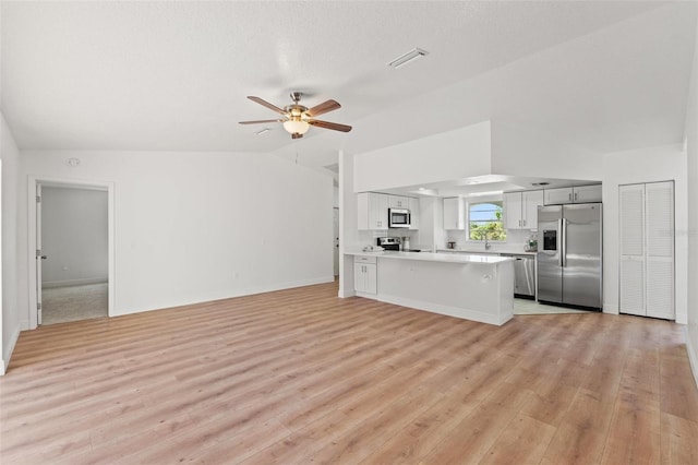 7048 Oberon Ave, Spring Hill, FL 34608 - unfurnished living room featuring light wood-type flooring, ceiling fan, and baseboards