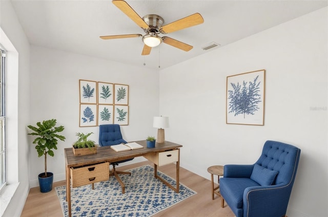 7048 Oberon Ave, Spring Hill, FL 34608 - office area with light wood-type flooring, ceiling fan, and baseboards