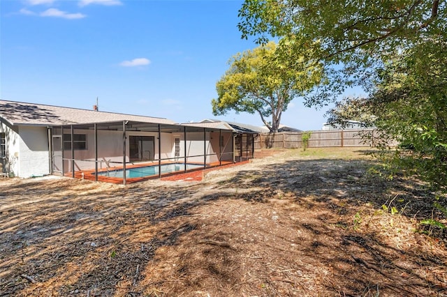 7048 Oberon Ave, Spring Hill, FL 34608 - back of house with a fenced backyard, a lanai, and a patio area
