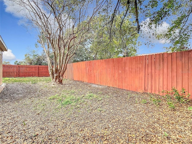 view of yard with a fenced backyard