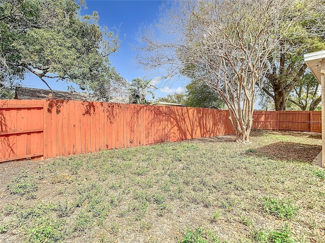 view of yard with a fenced backyard