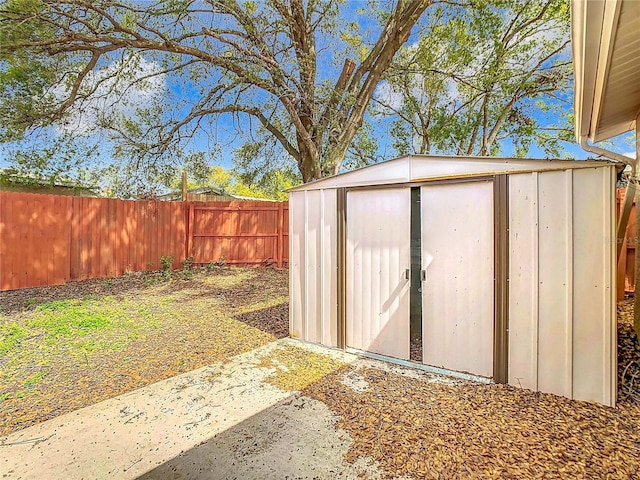 view of shed with a fenced backyard