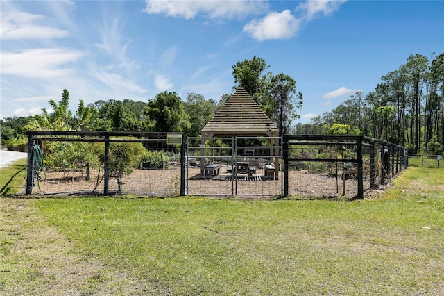 view of yard with fence and a gazebo