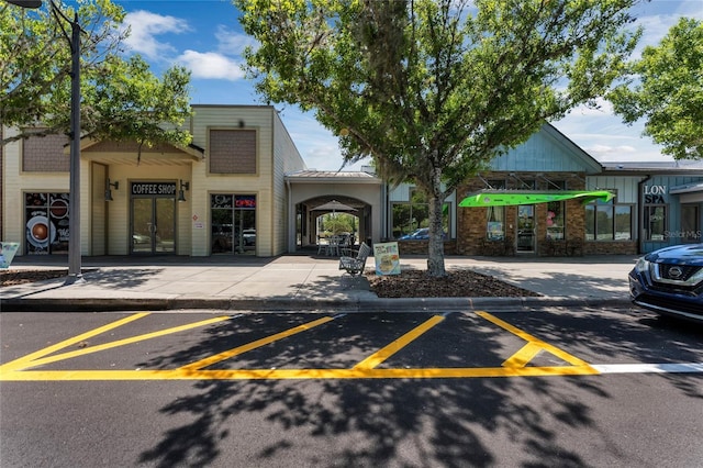 view of property with uncovered parking