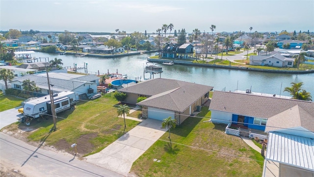 aerial view featuring a residential view and a water view