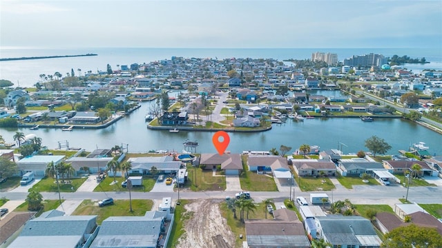 birds eye view of property featuring a water view