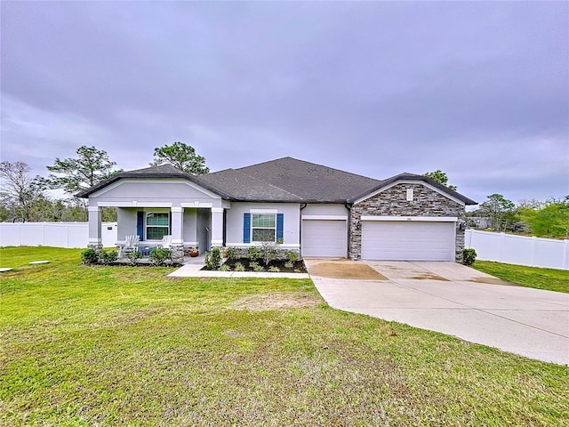 view of front of property featuring stucco siding, concrete driveway, an attached garage, fence, and a front lawn