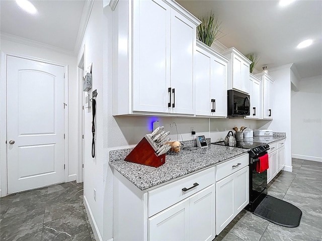 kitchen with black appliances, white cabinets, and crown molding