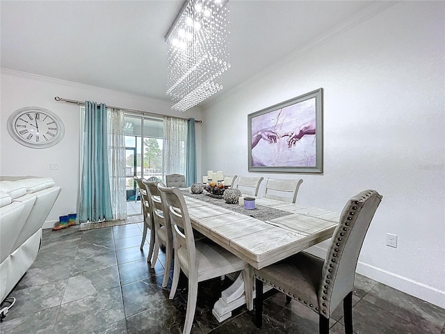 dining space with ornamental molding, baseboards, and an inviting chandelier