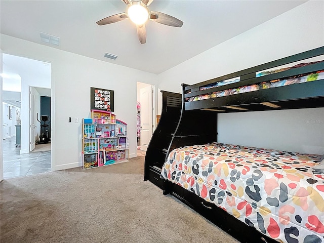 carpeted bedroom featuring visible vents, ceiling fan, and baseboards